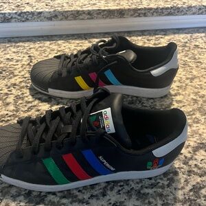 Adidas Superstar Black Sneakers with Vibrant Stripes